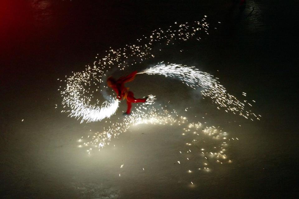 A skater is pictured during the Salt Lake 2002 Winter Games opening ceremony at the University of Utah’s Rice-Eccles Stadium on Friday, Feb 8, 2002. | Stuart Johnson, Deseret News
