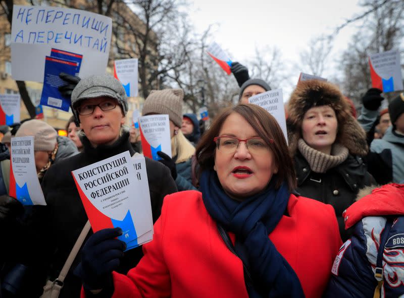 FILE PHOTO: Yulia Galyamina, a Moscow city councillor, holds copies of Russia's constitution during a rally against constitutional reforms proposed by President Vladimir Putin, in Moscow