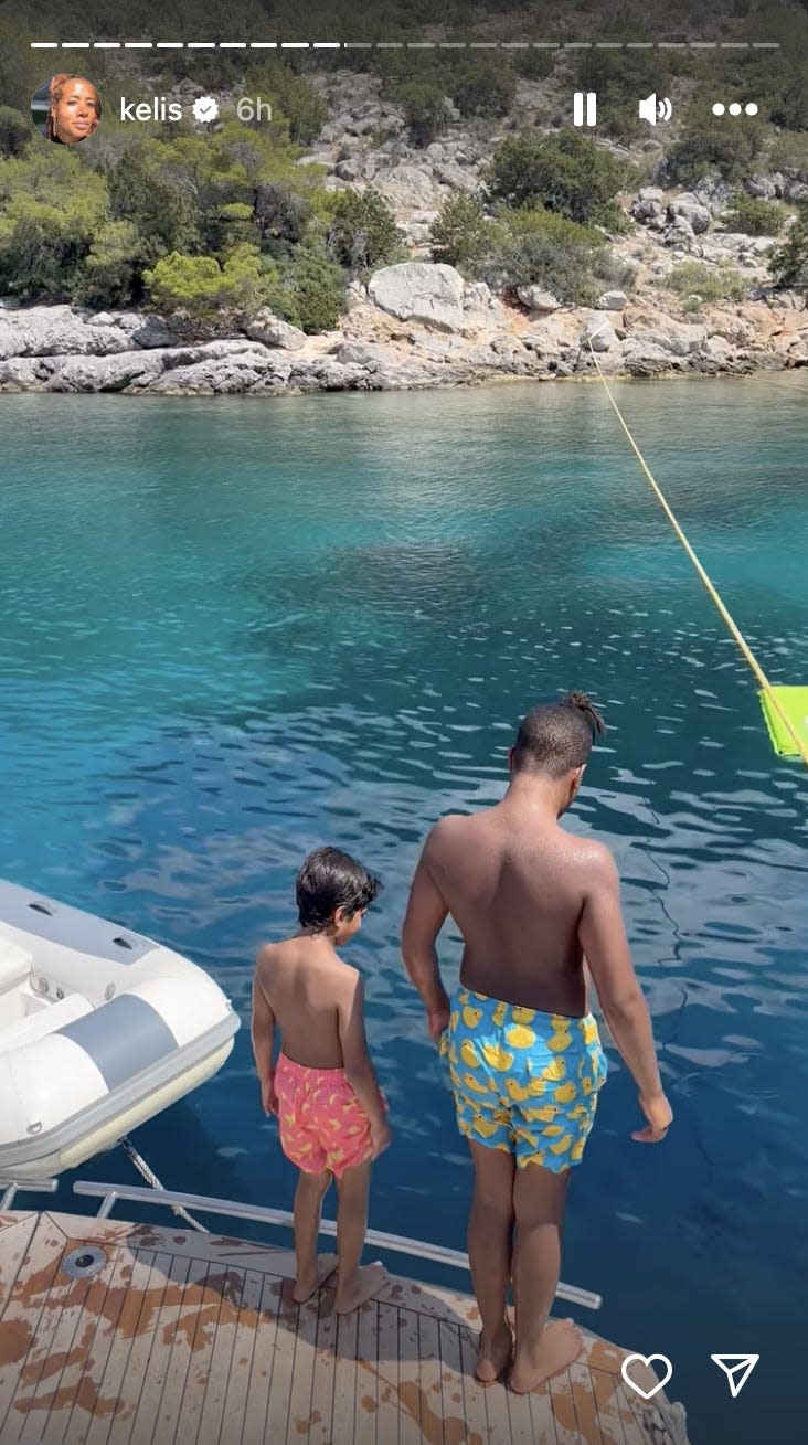 A photo of two boys about to jump into water