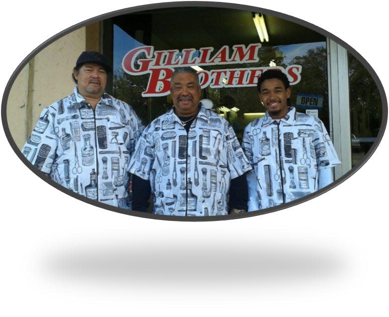Melvin, Ervin Omega Jr. and Desmond in front of the Gilliam Brothers barbershop in this 2017 photo.