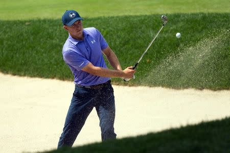 Jun 23, 2017; Cromwell, CT, USA; Jordan Spieth hits out of a sand bunker on the 18th hole during the second round of the Travelers Championship golf tournament at TPC River Highlands. Mandatory Credit: Bill Streicher-USA TODAY Sports