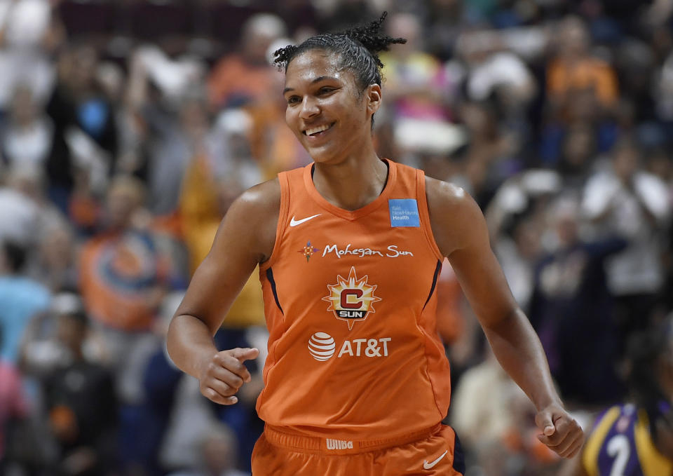 Connecticut Sun's Alyssa Thomas smiles after a basket during the second half of a WNBA basketball playoff game against the Los Angeles Sparks, Tuesday, Sept. 17, 2019, in Uncasville, Conn. (AP Photo/Jessica Hill)