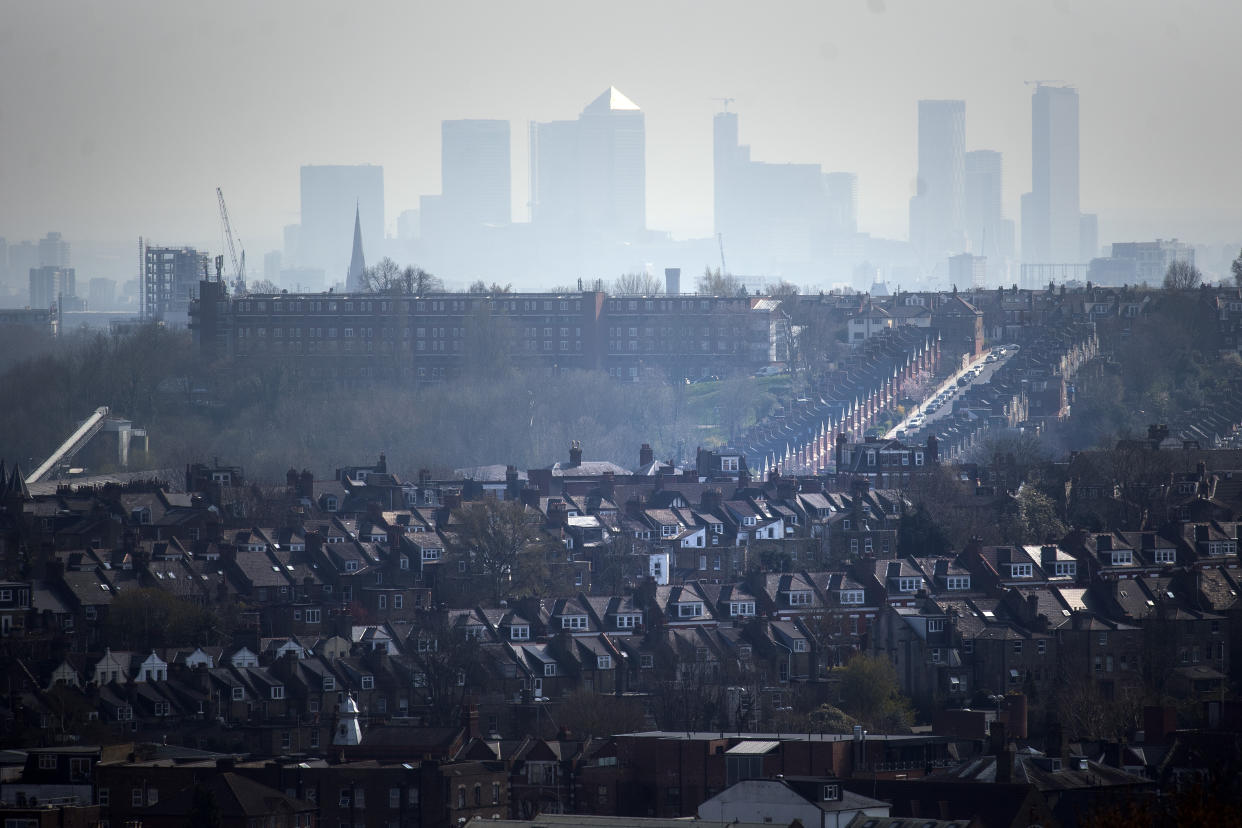 The Canary Wharf skyline viewed through the haze from Alexandra Palace, north London.