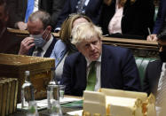 FILE - In this photo provided by UK Parliament, Britain's Prime Minister Boris Johnson attends Prime Minister's Questions in the House of Commons, in London, Jan. 19, 2022. Some Conservative lawmakers in Britain are talking about ousting Johnson, who has been tarnished by allegations that he and his staff held lockdown-breaching parties during the coronavirus pandemic. The party has a complex process for changing leaders that starts by lawmakers writing letters to demand a no-confidence vote. (Jessica Taylor/UK Parliament via AP, File)