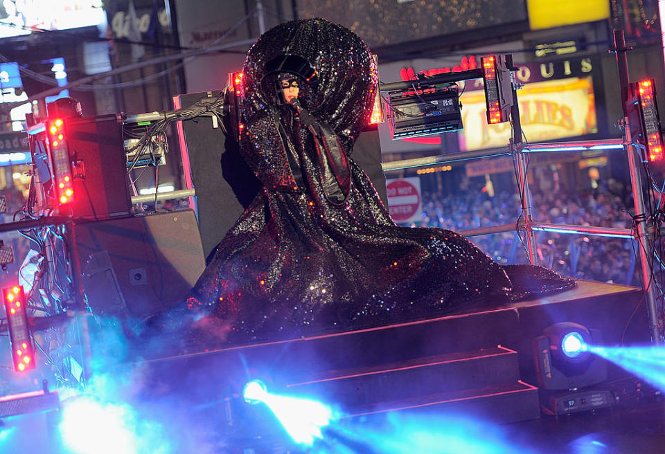 The performer is engulfed in swathes of glittering black material as she performs in Times Square on New Year’s Eve in 2011.