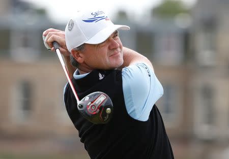 Paul Lawrie of Scotland watches his tee shot on the second hole during the final round of the British Open golf championship on the Old Course in St. Andrews, Scotland, July 20, 2015. REUTERS/Phil Noble