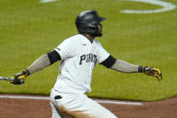 Pittsburgh Pirates' Gregory Polanco follows through on a sacrifice fly off San Francisco Giants relief pitcher Caleb Baragar that drove in the winning run during the 11th inning of a baseball game in Pittsburgh, Friday, May 14, 2021. The Pirates won 3-2. (AP Photo/Gene J. Puskar)