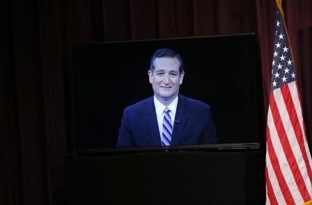 Republican U.S. presidential candidate and U.S. Senator Ted Cruz participates remotely via video conference during the Voters First Presidential Forum in Manchester, New Hampshire August 3, 2015. REUTERS/Brian Snyder