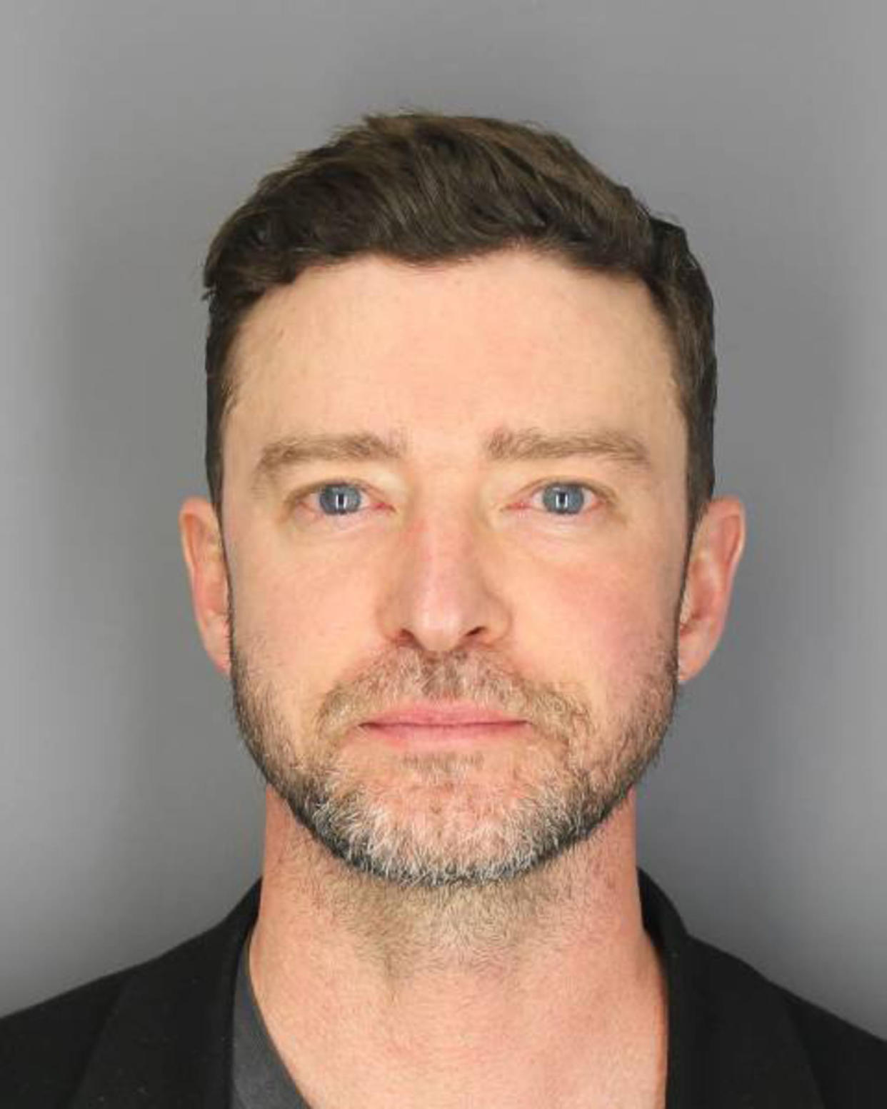 Justin Timberlake in a mug shot on a gray background. (Courtesy of Sag Harbor Police Department)