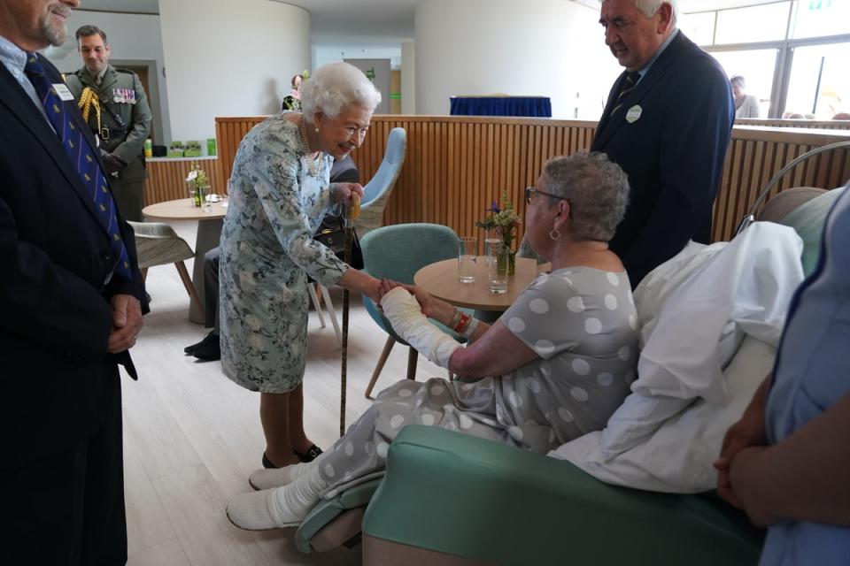 The Queen chatted to cancer patient Pat White, whose husband’s phone rang as they were being introduced (Kirsty O’Connor/PA) (PA Wire)