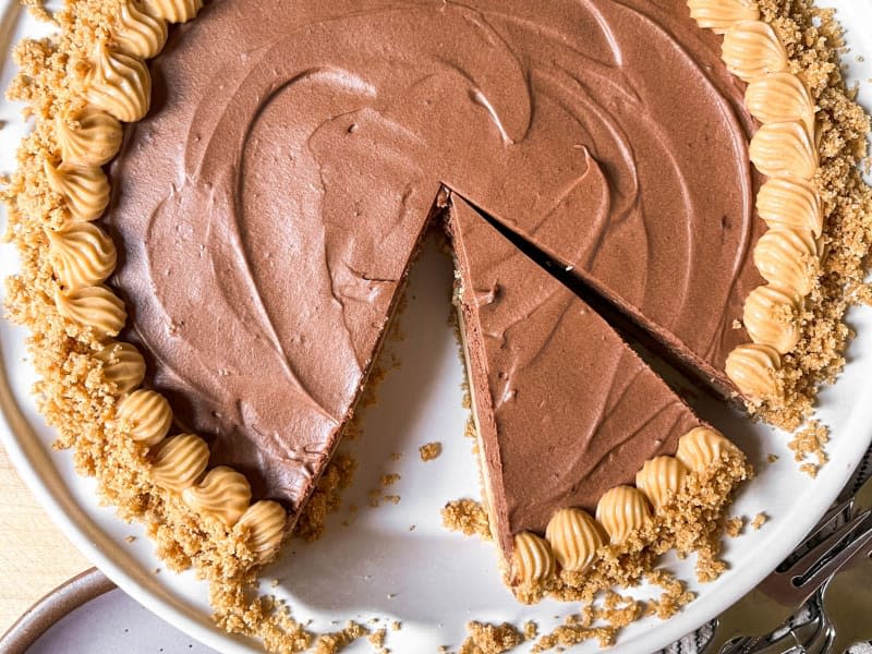 Copycat Costco chocolate peanut butter pie with slice ready to be plated.