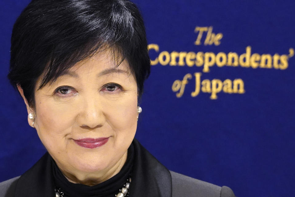 FILE - Tokyo Gov. Yuriko Koike poses for photographer before a press conference at the Foreign Correspondents' Club of Japan (FCCJ) in Tokyo, Feb. 13, 2023. Koike was asked to suspend a disputed $2.45 billion project to convert a beloved park district into a largely commercial area anchored around three skyscrapers. (AP Photo/Eugene Hoshiko, File)