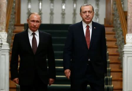 Russian President Vladimir Putin (L) and his Turkish counterpart Tayyip Erdogan arrive for a news conference following their meeting in Istanbul, Turkey, October 10, 2016. REUTERS/Osman Orsal