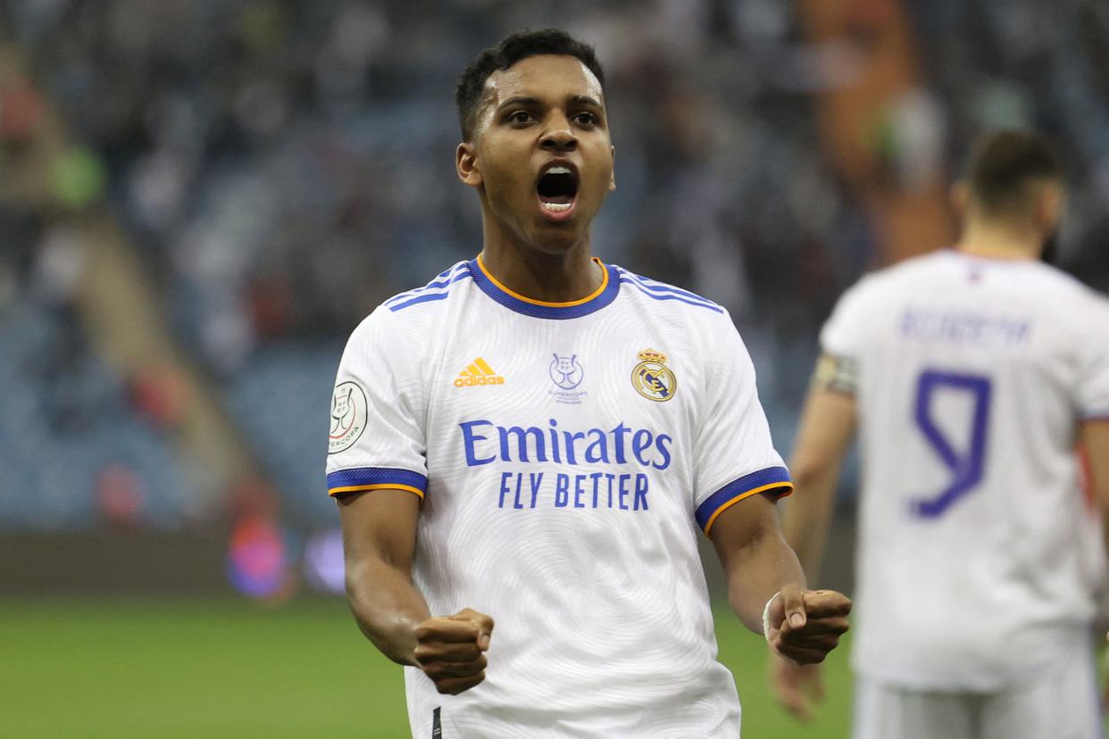 Real Madrid's Brazilian forward Rodrygo celebrates winning the Spanish Super Cup final football match against Athletic Bilbao on January 16, 2022, at the King Fahd International stadium in the Saudi capital of Riyadh. - Real Madrid won the Spanish Super Cup by beating Athletic Bilbao 2-0 as Luka Modric and a Karim Benzema penalty secured a comfortable victory in Saudi Arabia. (Photo by Fayez Nureldine / AFP) (Photo by FAYEZ NURELDINE/AFP via Getty Images)