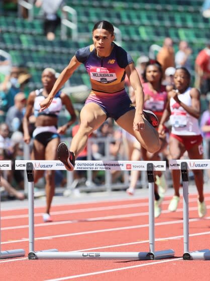 EUGENE, OREGON - JUNE 25: Sydney McLaughlin sets a world record in the final of the Women 400 Meter Hurdles.