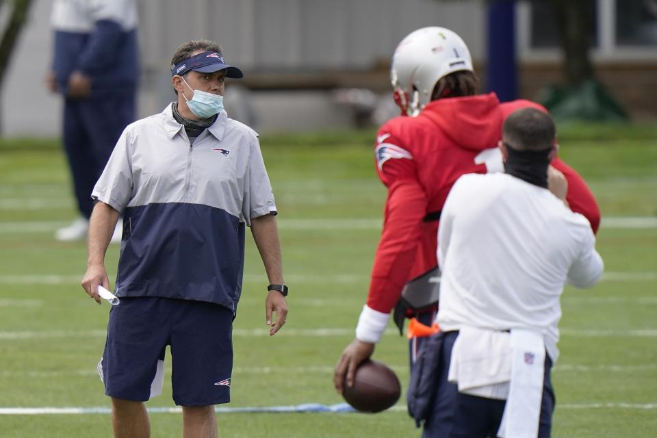 New England Patriots quarterback coach Jedd Fisch, left, speaks to quarterback Cam Newton (1) during an NFL football training camp practice, Monday, Aug. 17, 2020, in Foxborough, Mass. (AP Photo/Steven Senne, Pool)