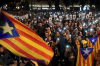 People take part in a demonstration in Barcelona against the trial of former Catalan separatist leaders