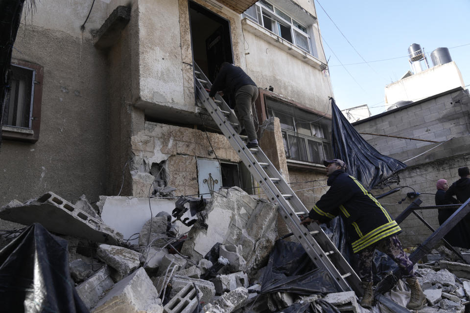 Palestinians look at the aftermath of the Israeli military raid on Nur Shams refugee camp in the West Bank on Sunday, Dec. 17, 2023. (AP Photo/Majdi Mohammed)