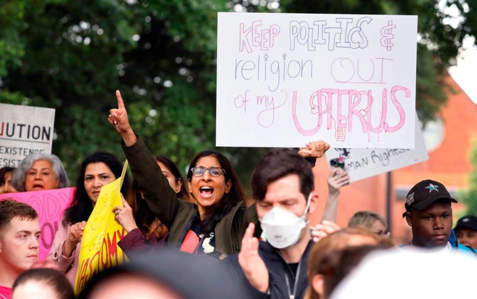 Archna Prasad-Gaur of Chapel Hill, center, cheers for a speaker outside the State Capitol in Raleigh, N.C. during the Bans Off Our Bodies abortion rights march and rally Saturday, May 14, 2022.