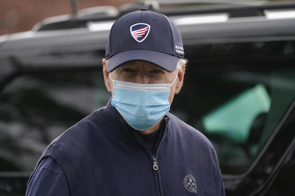 President Joe Biden walks to a motorcade vehicle after golfing at Wilmington Country Club, Saturday, April 17, 2021, in Wilmington, Del. Biden is spending the weekend at his home in Delaware. (AP Photo/Patrick Semansky)