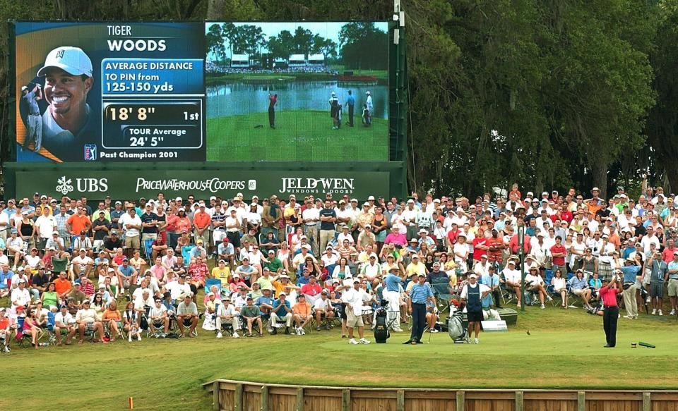 Players Championship fans watch Tiger Woods play the 17th hole of the Players Stadium Course at TPC Sawgrass.