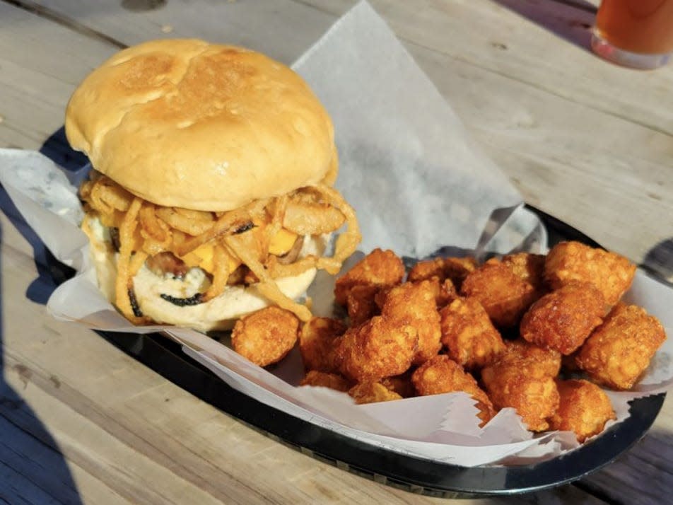 A burger and tater tots from City Acre Brewing