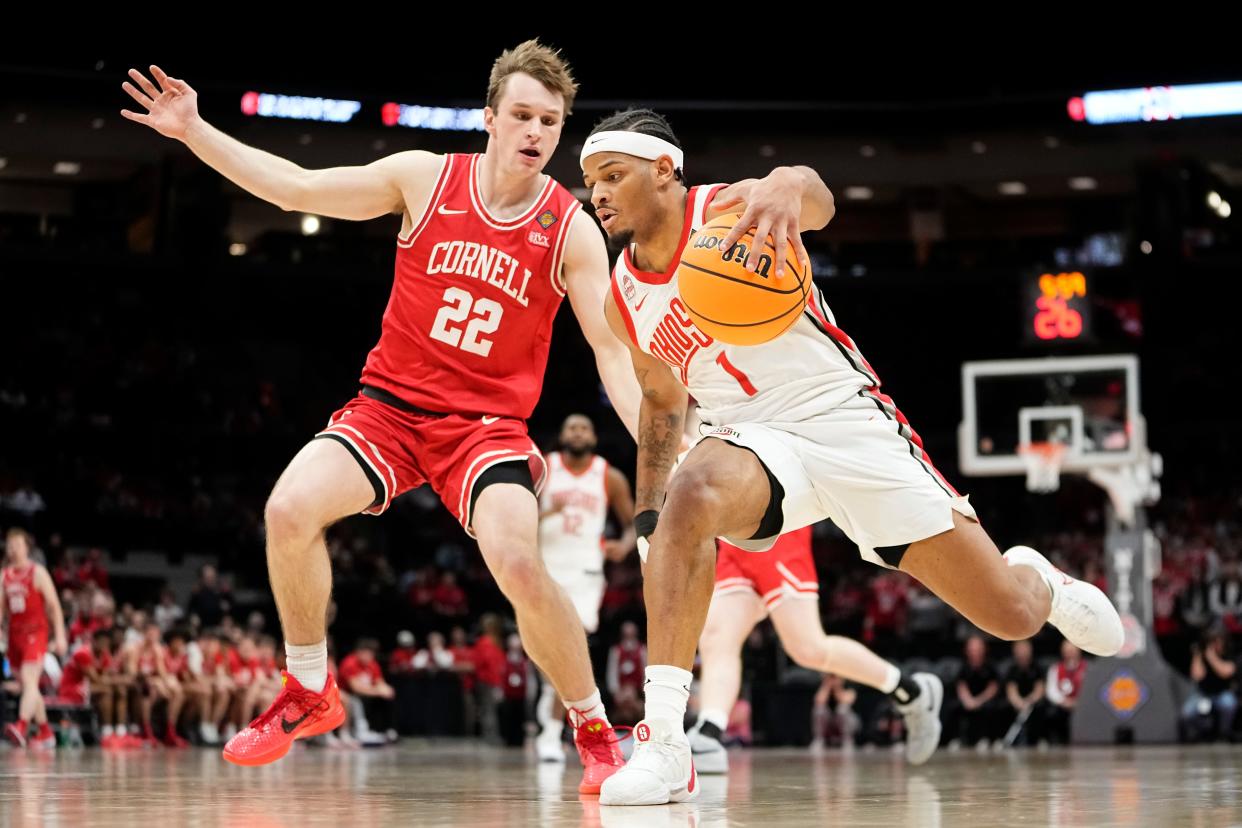 Mar 19, 2024; Columbus, OH, USA; Ohio State Buckeyes guard Roddy Gayle Jr. (1) dribbles past Cornell Big Red guard Jake Fiegen (22) during the second half of the NIT basketball game at Value City Arena. Ohio State won 88-83.