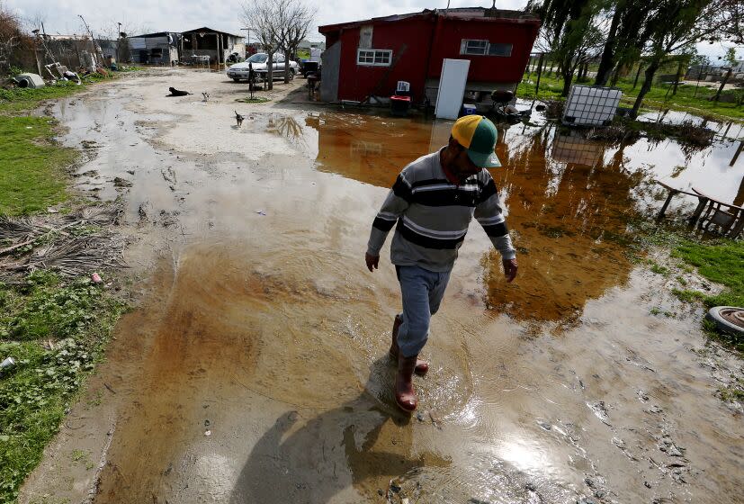 ALLENSWORTH, CALIF. - M,AR. 20, 2023. Floodwater flows around a residence in Allensworth, a small hamlet in rural San Joaquin Valley. Portions of the town have been flooded during recent rains because of its low-lying location. Residents are bracing for forecasted rain that may further innundate the community. (Luis Sinco / Los Angeles Times)