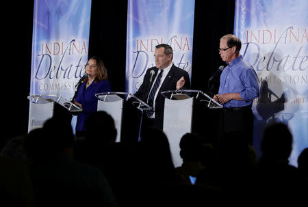 L-R: Libertarian Lucy Brenton, Democratic U.S. Sen. Joe Donnelly and Republican former state Rep. Mike Braun, participate in a U.S. Senate Debate, in Westville, Indiana, U.S., October 8, 2018. Darron Cummings/Pool via REUTERS