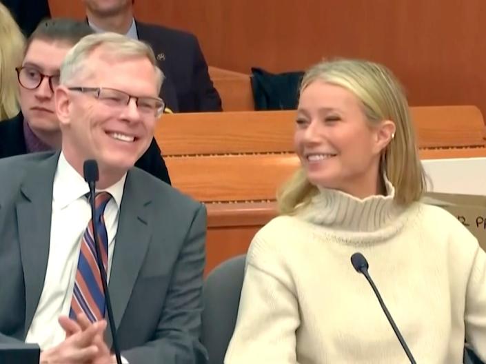 Gwenyth Paltrow smiles next to her lawyer Steve Owens during a hearing in Park City, Utah.