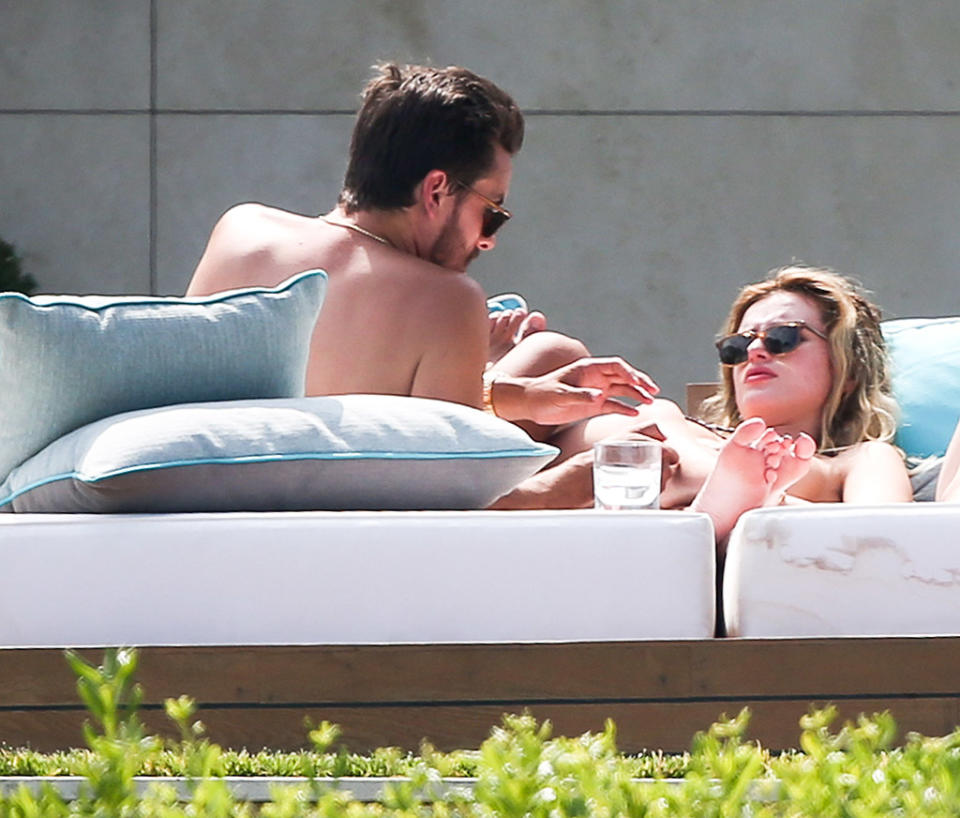 Scott Disick and Bella Thorne just lounging. (Photo: Splash News)