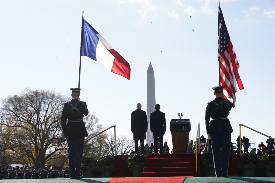 President Joe Biden and French President Emmanuel Macron stand on stage during a State Arrival Ceremony on the South Lawn of the White House in Washington, Thursday, Dec. 1, 2022. (AP Photo/Andrew Harnik)