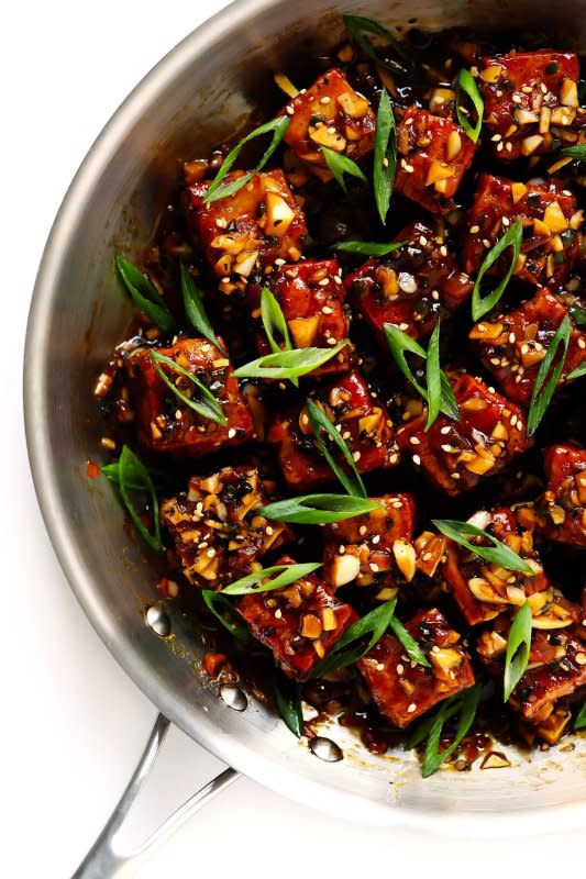 <p>Gimme Some Oven</p><p>An unbelievably delicious tofu stir-fry, made with my easy baked tofu recipe and tossed with the most heavenly garlic black pepper sauce.</p><p><strong>Get the recipe: <a href="https://www.gimmesomeoven.com/magic-garlicky-tofu/" rel="nofollow noopener" target="_blank" data-ylk="slk:Magic Garlicky Tofu;elm:context_link;itc:0;sec:content-canvas" class="link "><em>Magic Garlicky Tofu</em></a></strong></p>