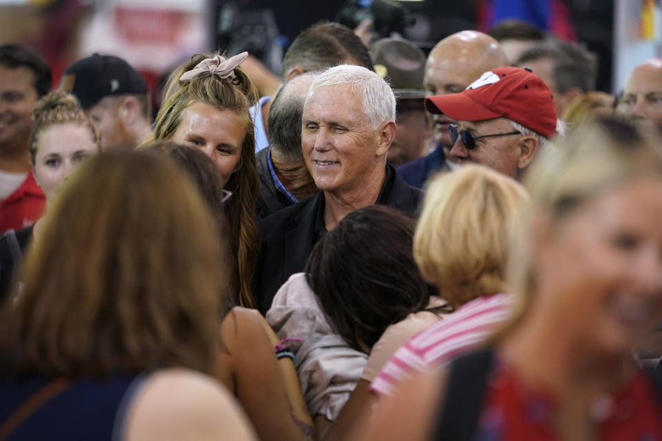 Former Vice President Mike Pence greets fairgoers during a visit to the Iowa State Fair, Friday, Aug. 19, 2022, in Des Moines, Iowa. (AP Photo/Charlie Neibergall)