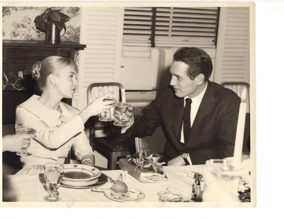 Joanne Woodward and Paul Newman give a toast, one of the family photographs used in "The Last Movie Stars."