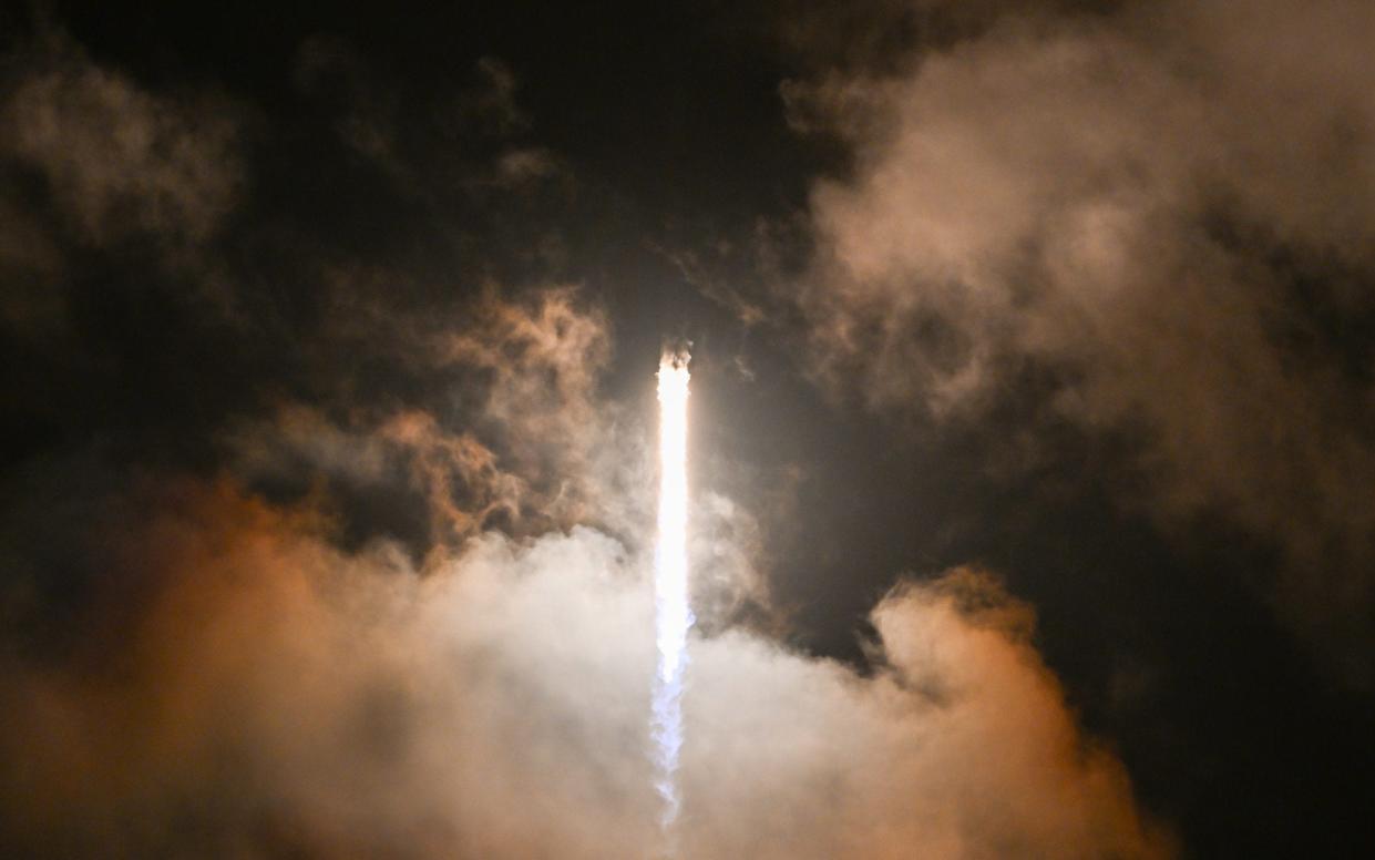 A SpaceX Falcon 9 rocket with the Crew Dragon Resilience capsule