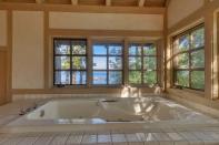 And there are seven bathrooms. One featuring this bath with possibly the best view we've ever seen. Photo: IMP/australscope