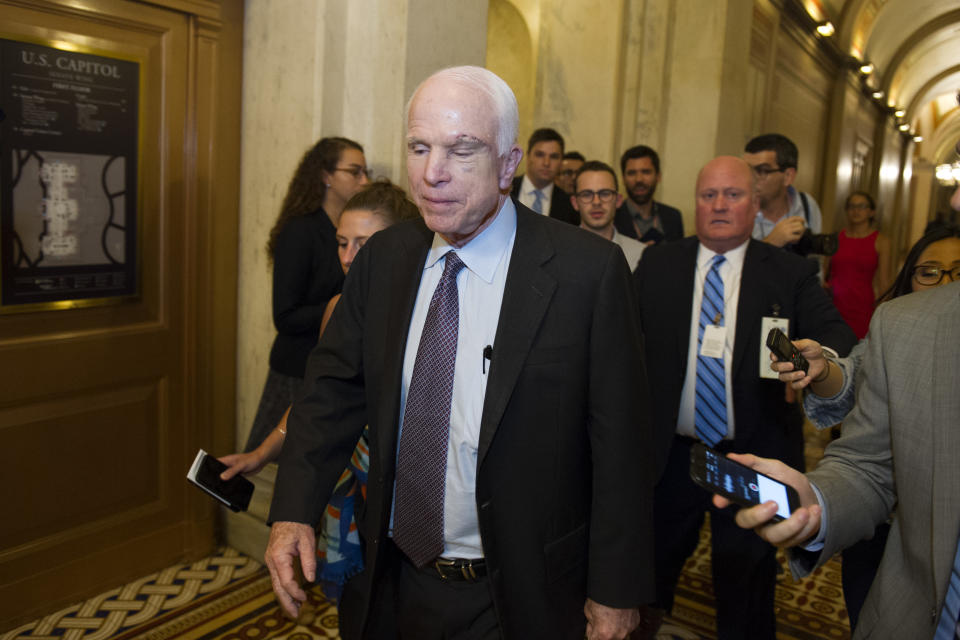 Sen. John McCain, R-Az., is pursued by reporters after casting a ‘no’ vote on a a measure to repeal parts of former President Barack Obama’s health care law, on Capitol Hill in Washington, Friday, July 28, 2017. (Photo: Cliff Owen/AP)