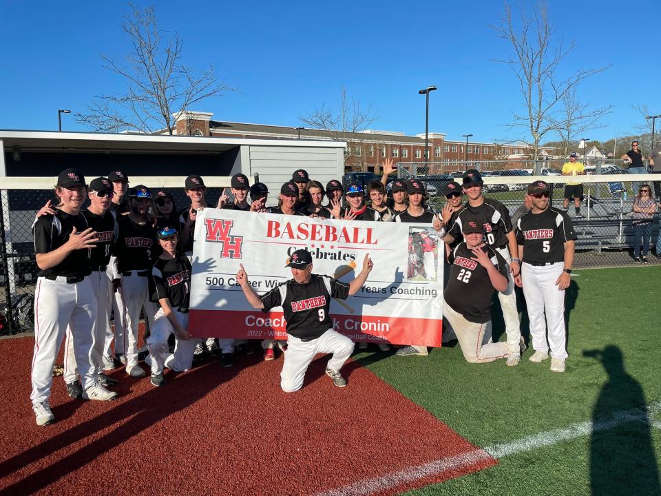 Panthers coach Pat Cronin, front, celebrates with his Whitman-Hanson High baseball team after earning his 500th career win on Friday, May 13, 2022.