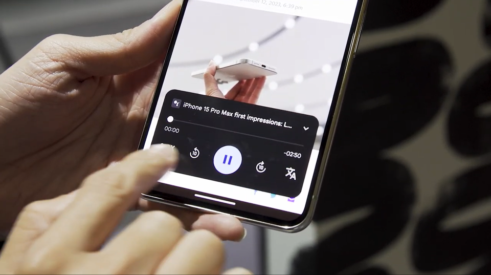 The read aloud playback box at the bottom of the Pixel 8 Pro's screen. The control panel shows the title of the article, a progress bar, time stamps, a pause button flanked by 10-second rewind and skip ahead buttons. At the bottom right is a translate icon.
