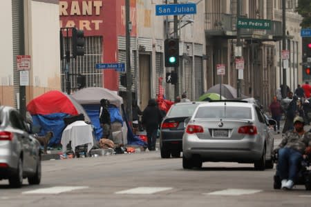 Tents and tarps erected by homeless people are shown along the sidewalks in the skid row area of downtown Los Angeles, California