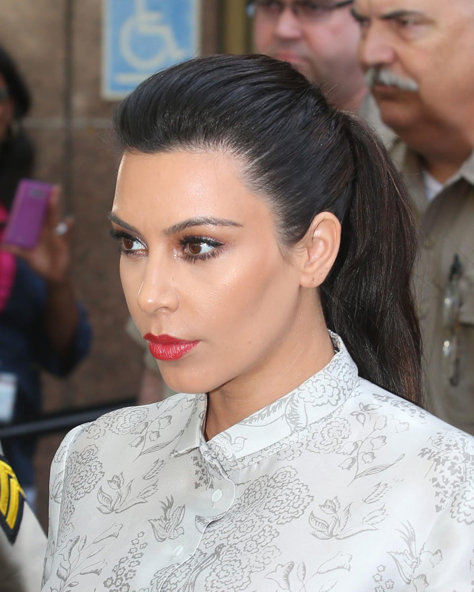 LOS ANGELES, CA - APRIL 12:  Kim Kardashian surrounded by Los Angeles County Sheriff Deputies leaves the Stanley Mosk Courthouse after attending her divorce hearing from Kris Humphries on April 12, 2013 in Los Angeles, California. Kim Kardashian and NBA player Kris Humphries are appearing for divorce proceedings. Humphries is seeking an annulment of their ten-week marriage, claiming it was based on fraud.  (Photo by Frederick M. Brown/Getty Images)