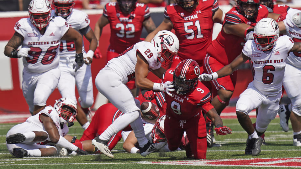 Southern Utah safety George Ramirez defends as Utah running back Tavion Thomas (9) fumbles the ball during the first half of an NCAA college football game, Saturday, Sept. 10, 2022, in Salt Lake City. (AP Photo/Rick Bowmer)