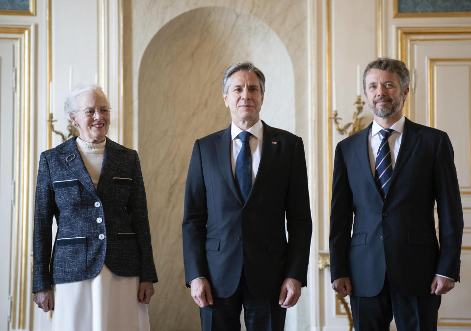 Denmark's Queen Margrethe II, left and Crown Prince Frederik, right, pose for a photo with US Secretary of State Antony Blinken, at Amalienborg Palace in Copenhagen, Denmark, Monday, May 17, 2021. Blinken is seeing Danish leaders as well as top officials from Greenland and the Faeroe Islands in Copenhagen on Monday before he heads to Iceland for an Arctic Council meeting that will be marked by his first face-to-face talks with Russian Foreign Minister Sergey Lavrov at a time of significantly heightened tensions between Washington and Moscow. (Saul Loeb/Pool Photo via AP)
