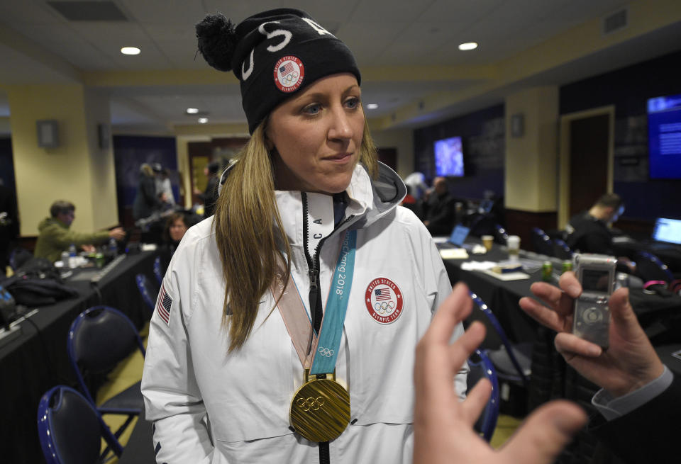 FILE - In this March 3, 2018, file photo, Meghan Duggan, of the gold medal-winning U.S. women's Olympic hockey team, listens to a question from the media before an outdoor NHL hockey game between the Washington Capitals and the Toronto Maple Leafs in Annapolis, Md. U.S. women's hockey captain Duggan announced her retirement Tuesday, Oct. 13, 2020, after a career in which she won the 2018 Olympic gold medal and seven world championship golds. (AP Photo/Nick Wass, File)