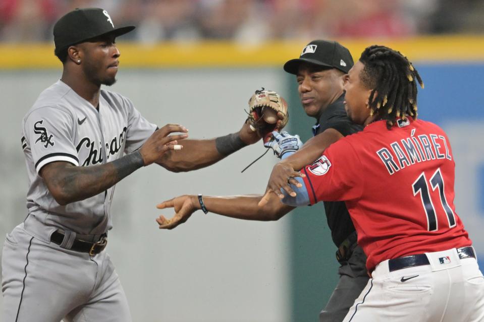 Umpire Malachi Moore tries to separate Cleveland Guardians third baseman Jose Ramirez (11) and Chicago White Sox shortstop Tim Anderson (7) after Ramirez slid into second with an RBI double during the sixth inning Saturday at Progressive Field.