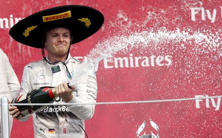 Mercedes Formula One driver Nico Rosberg of Germany celebrates after winning the Mexican F1 Grand Prix at Autodromo Hermanos Rodriguez in Mexico City, November 1, 2015. REUTERS/Edgard Garrido