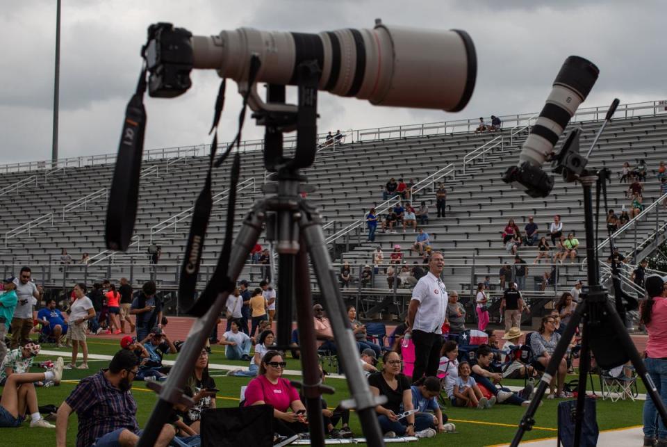 Hundreds of people fill the turf just before the totality of the solar eclipse at the Eagle Pass Independent School District Student Activities Center in Eagle Pass on April 08, 2024.