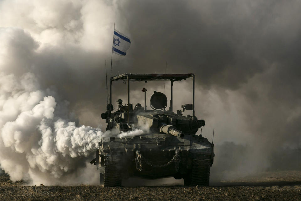 An Israeli tank moves along the border with the Gaza Strip on January 24, 2024 in Southern Israel. (Amir Levy / Getty Images)