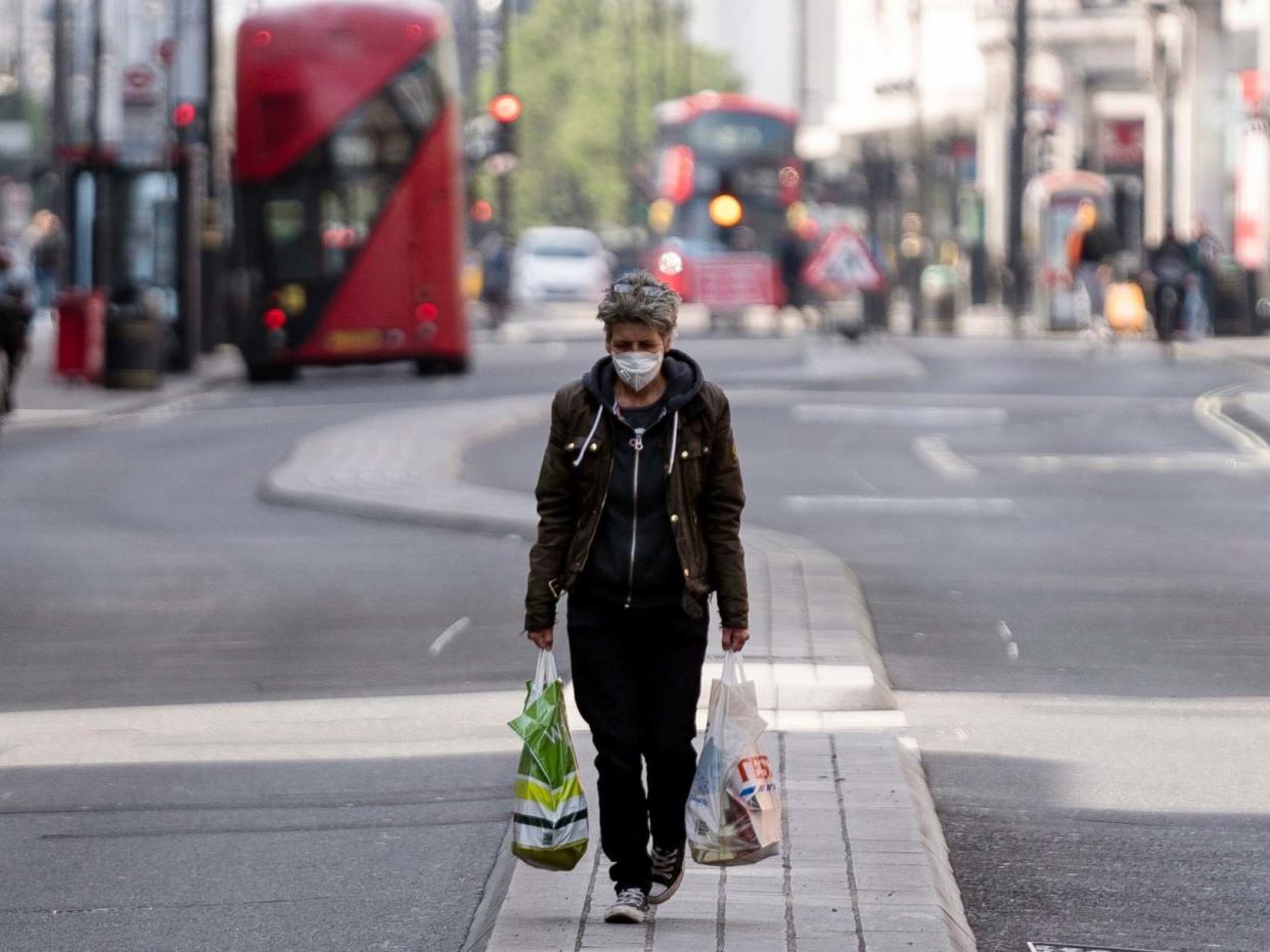 A lone shopper walks down central London's Oxford Street this week: EPA